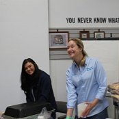 Board Members Rachel Hern and Natalie Green prepare to serve up the hot dogs and chips.