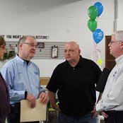 Executive Director Lavon Welty discusses with Frank Gorman, Habitat for Humanity International representative and Bruce Hilty, affiliate Board President their place in the program while Lavon's wife, Carol looks on.