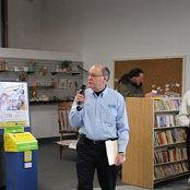 Executive Director, Lavon Welty, invites the guests to join together for the morning's dedication program.