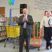 Lima City Mayor David Berger speaks to the crowd about the role Habitat plays in improving the lives of famlies in the city and county while Frank Gorman listens.