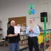 Executive Driector, Lavon Welty, presents affiliate Board President Bruce Hilty with the formal certificate of occupancy received earlier in the week.